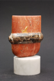 Sculpture 1989,
Persian red travertine, black Brecciato marble, 13 × 13 x 6 cm, 
base, white marble, 5 × 8 cm
